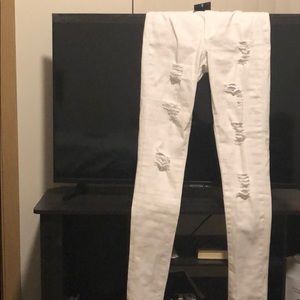 Unworn white cut up jeans from fashion nova.